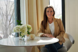 Carol Interiors Photoshoot - Carol sitting at the table