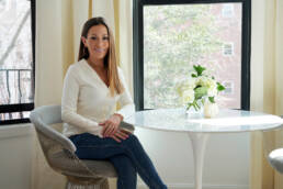 Carol Interiors Photoshoot - Carol sitting at the table