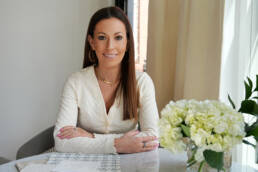 Carol Interiors Photoshoot - Carol sitting at the table