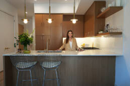 Carol Interiors Photoshoot - Carol Standing at the counter