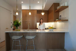 Carol Interiors Photoshoot - Carol Standing at the counter